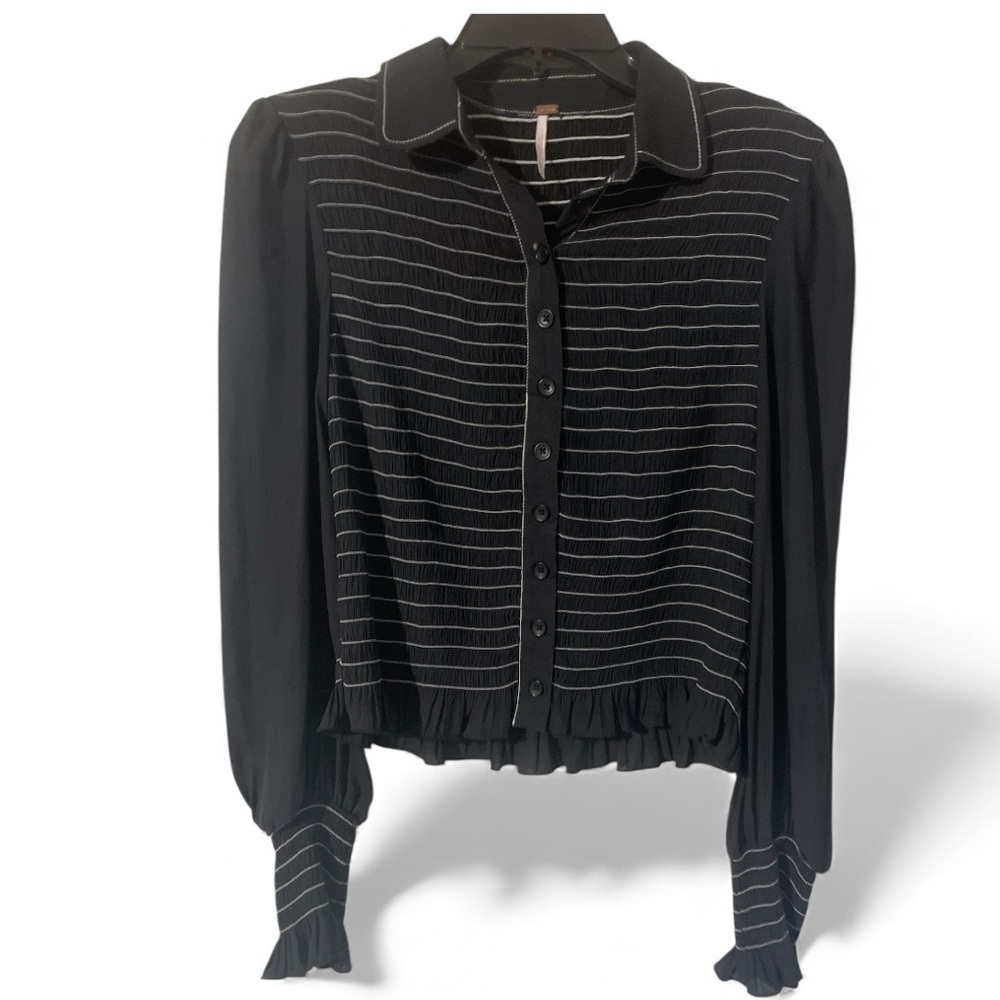 Free People black long-sleeve smocked button-down blouse with white stitching.